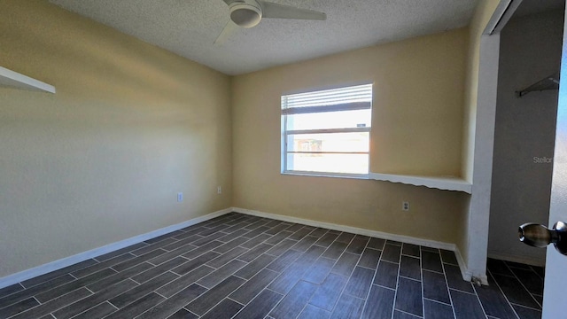 unfurnished room featuring a textured ceiling and ceiling fan