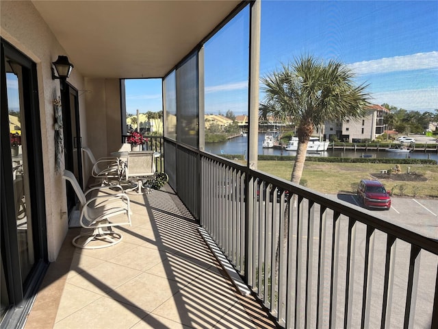 balcony featuring a water view