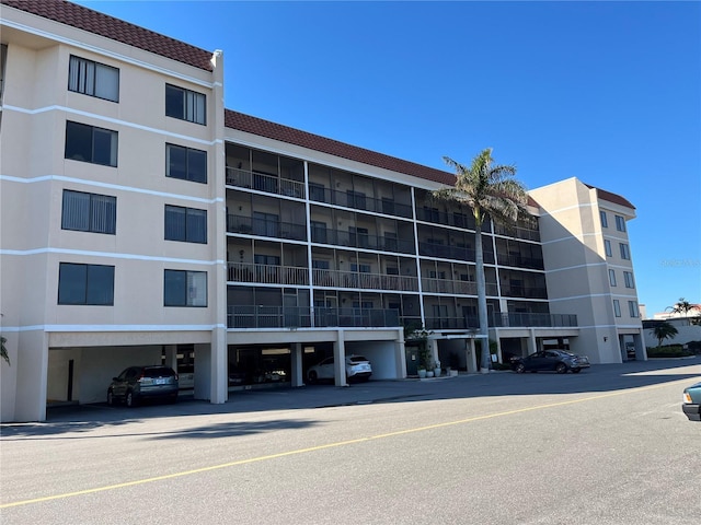 view of building exterior featuring a parking lot