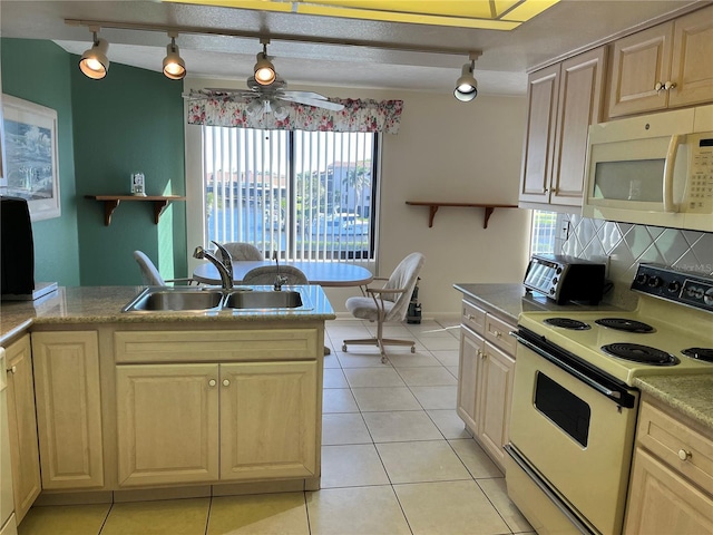 kitchen with white appliances, light tile patterned floors, a sink, and open shelves