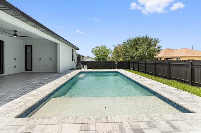 view of swimming pool with a fenced backyard, ceiling fan, a fenced in pool, and a patio