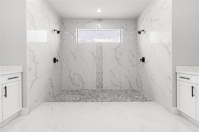 full bath with marble finish floor, a marble finish shower, and vanity