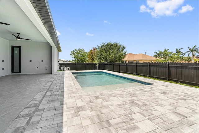 view of swimming pool with a patio area, a fenced backyard, a fenced in pool, and a ceiling fan