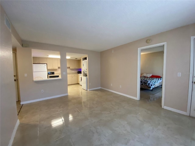 unfurnished living room with a textured ceiling