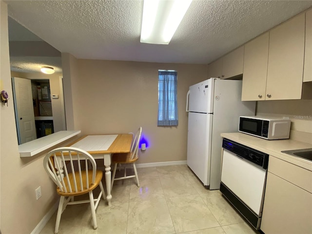 kitchen featuring white cabinets, light tile patterned floors, a textured ceiling, and white dishwasher