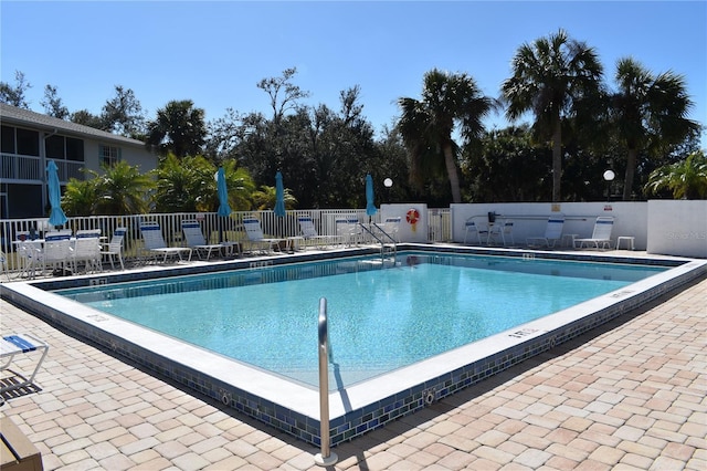 view of swimming pool featuring a patio area