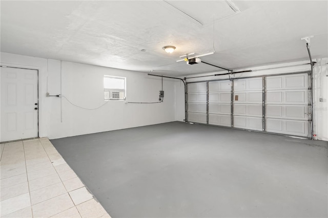 garage featuring cooling unit and a garage door opener