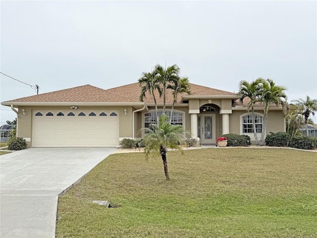 view of front of house featuring a garage and a front yard