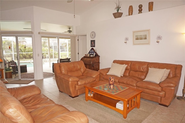 living room featuring light tile patterned floors and ceiling fan