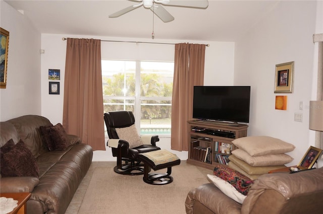 living room featuring light colored carpet and ceiling fan