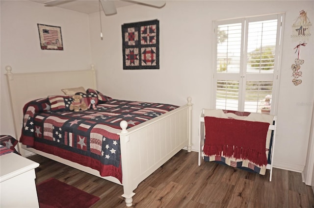 bedroom with dark hardwood / wood-style floors and ceiling fan