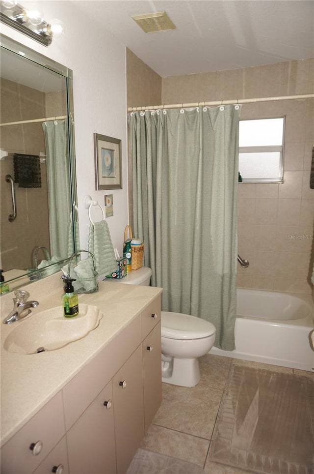 full bathroom featuring vanity, shower / bathtub combination with curtain, and toilet