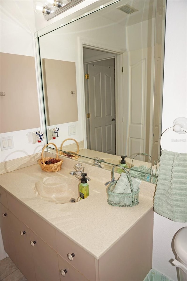 bathroom with vanity and tile patterned flooring