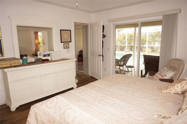 bedroom with dark wood-type flooring and access to exterior