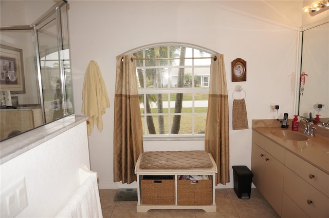 bathroom with tile patterned flooring and vanity