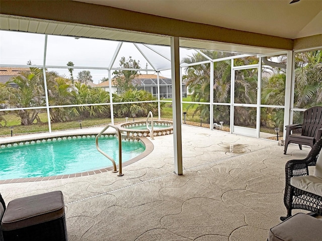 view of swimming pool with an in ground hot tub, glass enclosure, and a patio