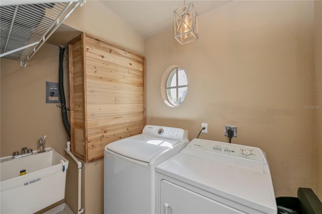 laundry area featuring washing machine and dryer and sink