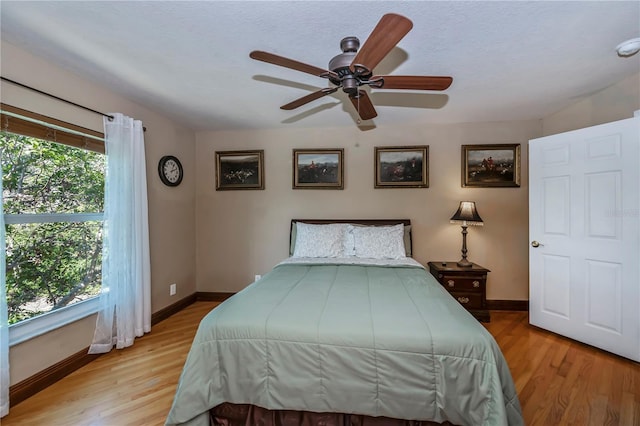 bedroom featuring ceiling fan and light wood-type flooring