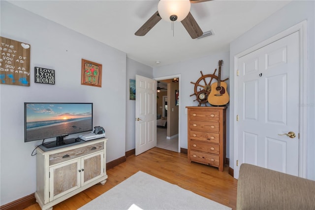 interior space with ceiling fan and light hardwood / wood-style flooring