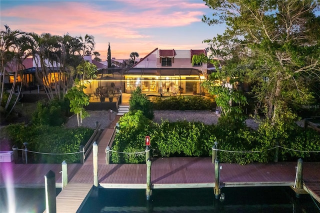 view of back house at dusk