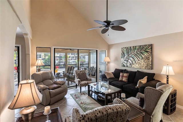 tiled living room with high vaulted ceiling and ceiling fan