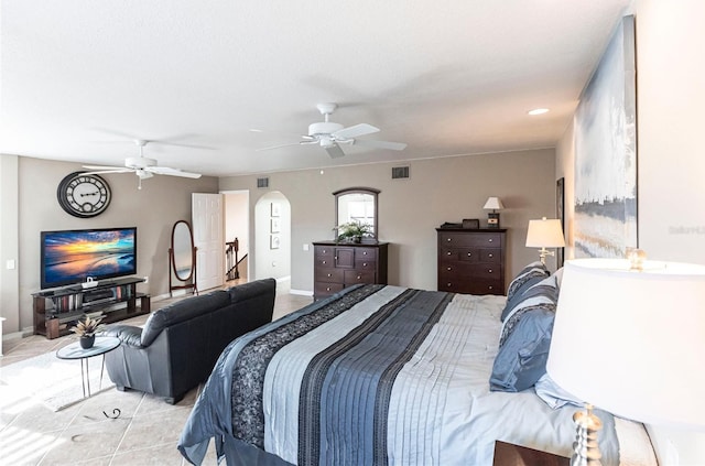 bedroom with light tile patterned floors and ceiling fan