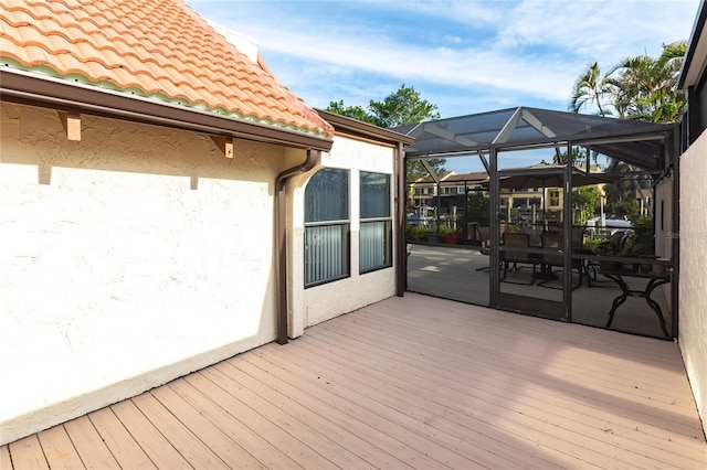 wooden deck with a lanai