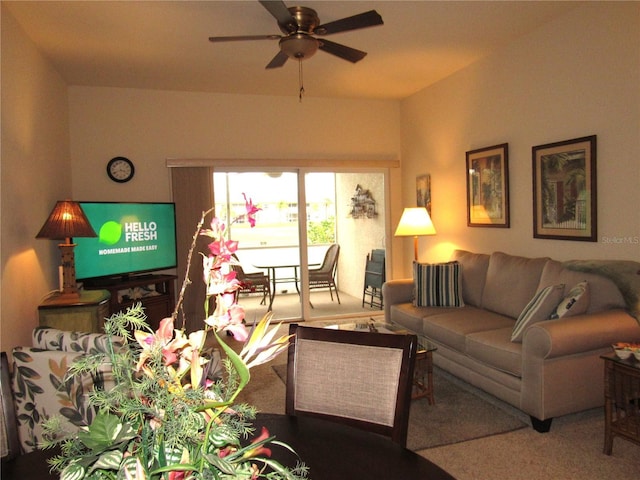 living room featuring carpet flooring and ceiling fan