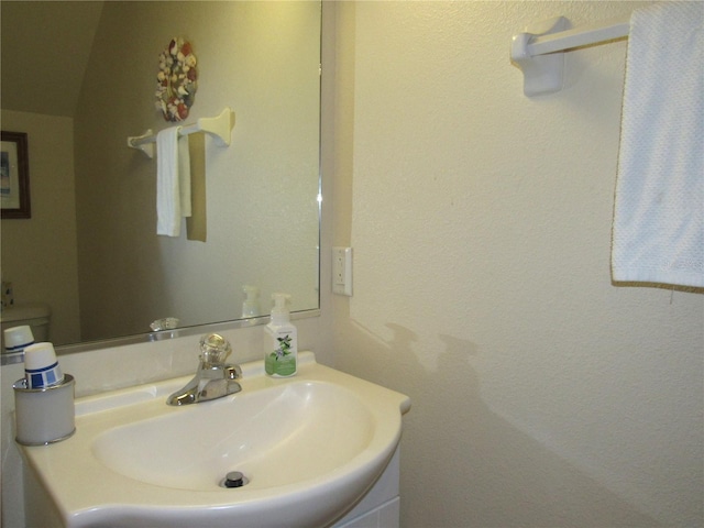 bathroom featuring sink and toilet