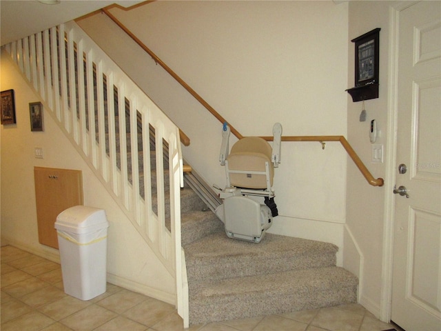 stairway with tile patterned flooring