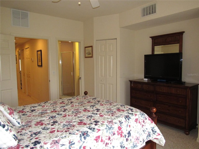 carpeted bedroom featuring ceiling fan and a closet