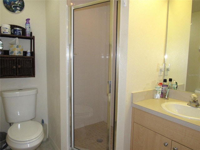 bathroom featuring walk in shower, tile patterned floors, vanity, and toilet