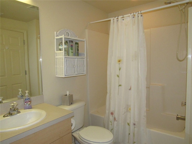 full bathroom with shower / bathtub combination with curtain, vanity, and toilet