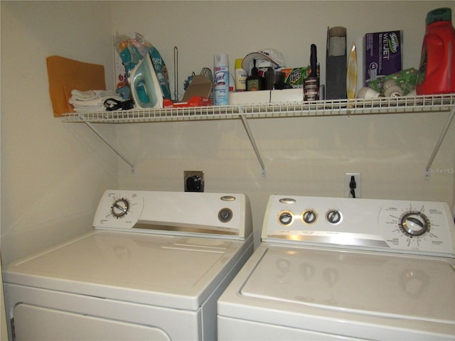 clothes washing area featuring separate washer and dryer