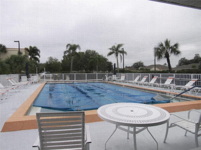 view of swimming pool with a patio