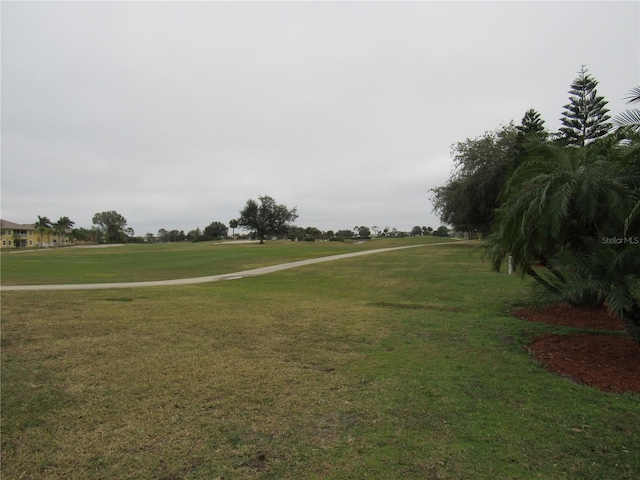 view of home's community with a lawn