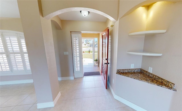 foyer entrance with light tile patterned flooring