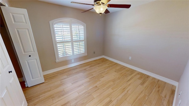 unfurnished room with ceiling fan and light wood-type flooring