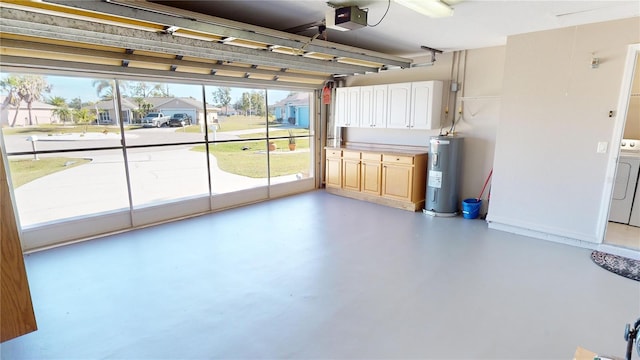 garage with washer / clothes dryer, a garage door opener, and water heater