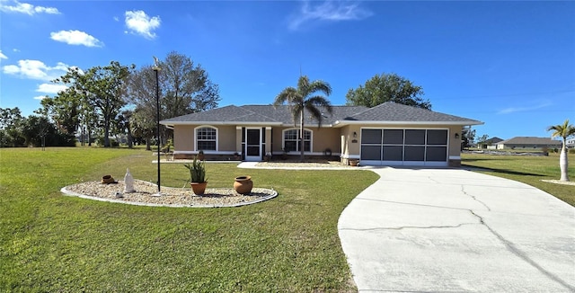 single story home featuring a garage and a front lawn