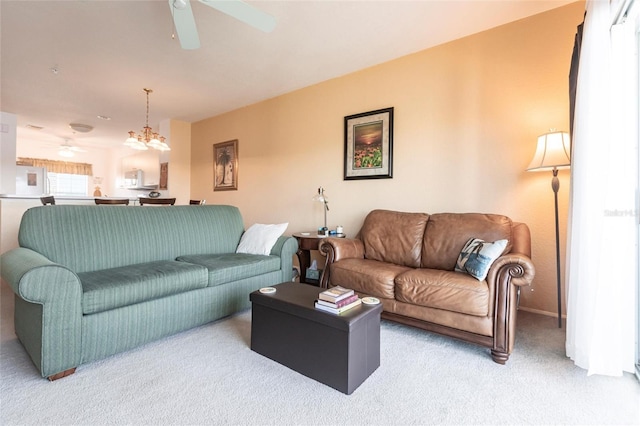 carpeted living room featuring ceiling fan