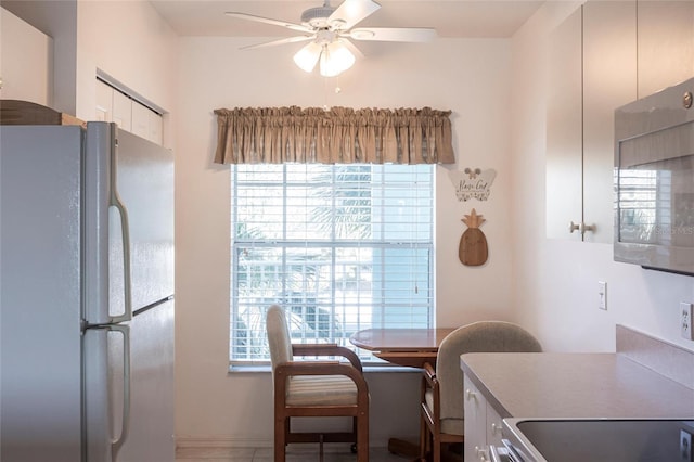 dining space featuring ceiling fan