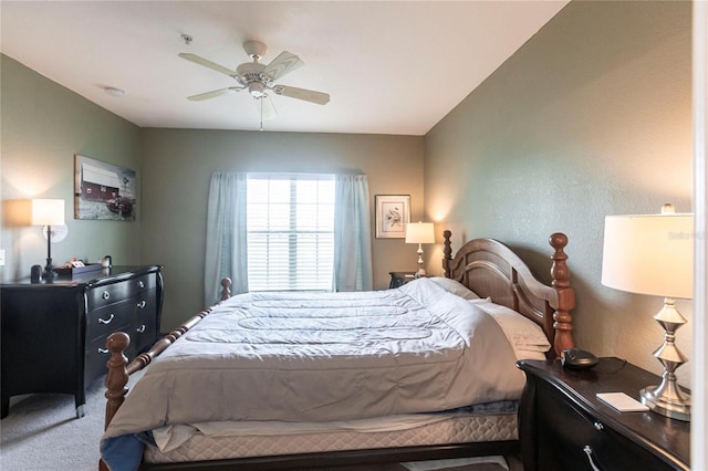 bedroom featuring ceiling fan and carpet