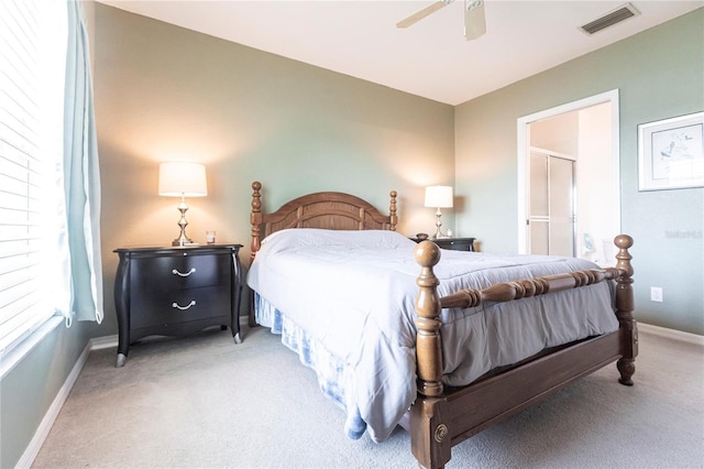 bedroom featuring light colored carpet and ceiling fan