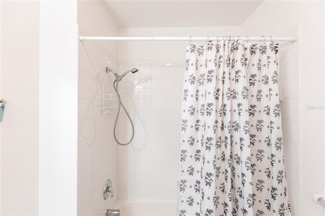 bathroom with shower / bathtub combination with curtain