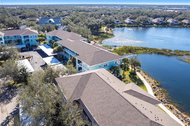 birds eye view of property with a water view