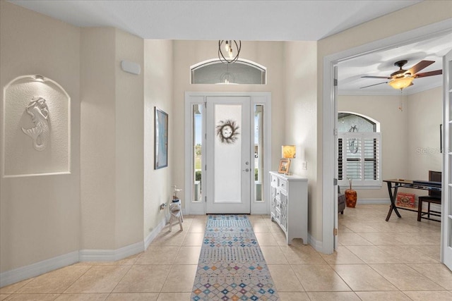 foyer entrance featuring ceiling fan and light tile patterned floors