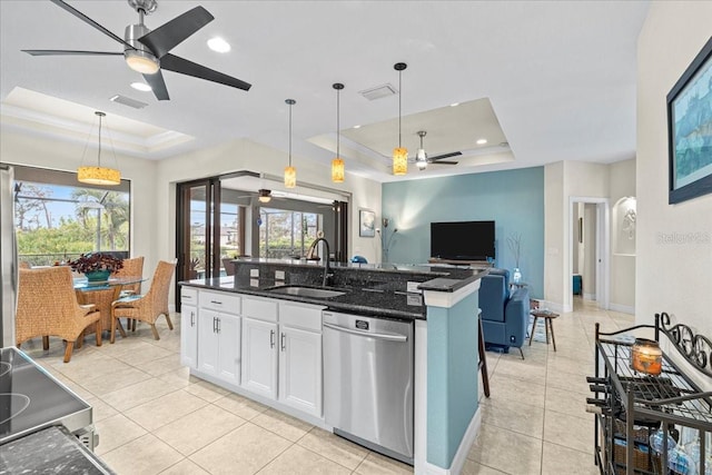 kitchen with white cabinetry, appliances with stainless steel finishes, a raised ceiling, and sink