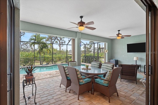 sunroom / solarium with ceiling fan