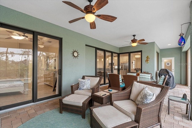 view of patio featuring ceiling fan